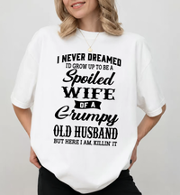 Spoiled Wife Of A Grumpy Old Husband Shirt – Funny Marriage Quote Graphic Tee, Couple Humor Black Cotton Short Sleeve Top