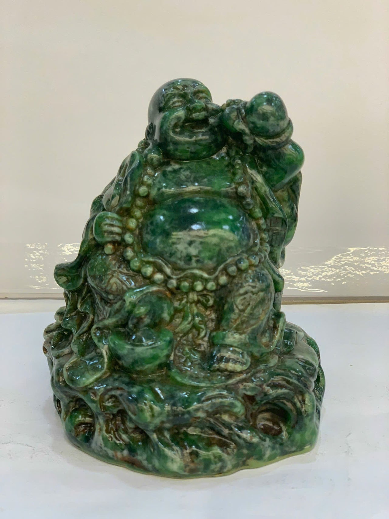 SITTING HAPPY BUDDHA LANDSCAPE JADE STATUE, JOYFUL AND CHEERFUL, HOLDING A GOURD AND A FAN, HAND-CARVED BY ARTISANS, GIFT FOR HIM, GIFT FOR FATHER, OFFICE DECOR, HANDMADE SCULPTURE.