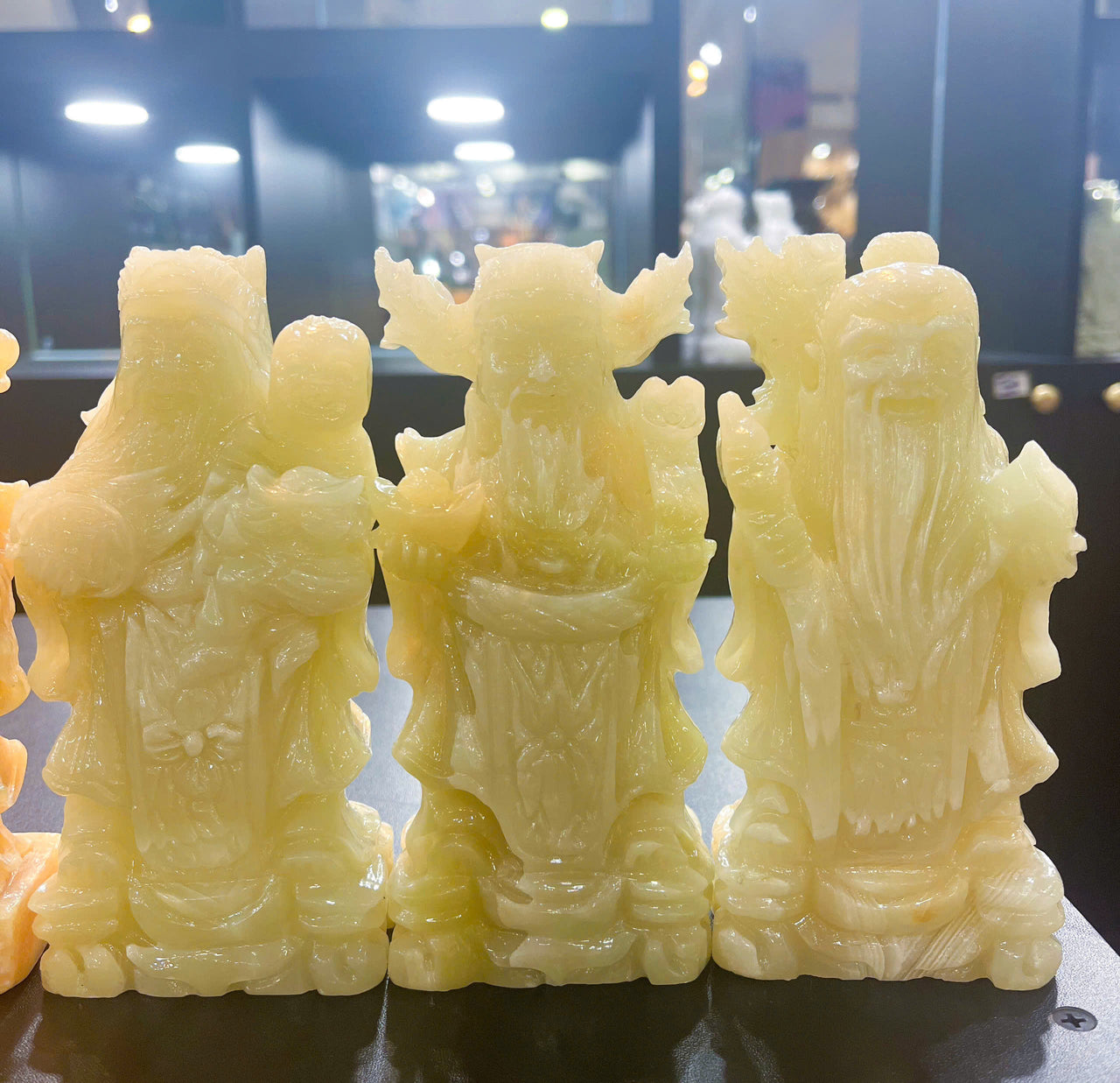 A METICULOUSLY HAND CARVED NATURAL JADE STATUE OF THE THREE DEITIES OF HAPPINESS-WEALTH-LONGEVITY. DIMENSIONS: L2.7in-W1.5in-H1.9in.